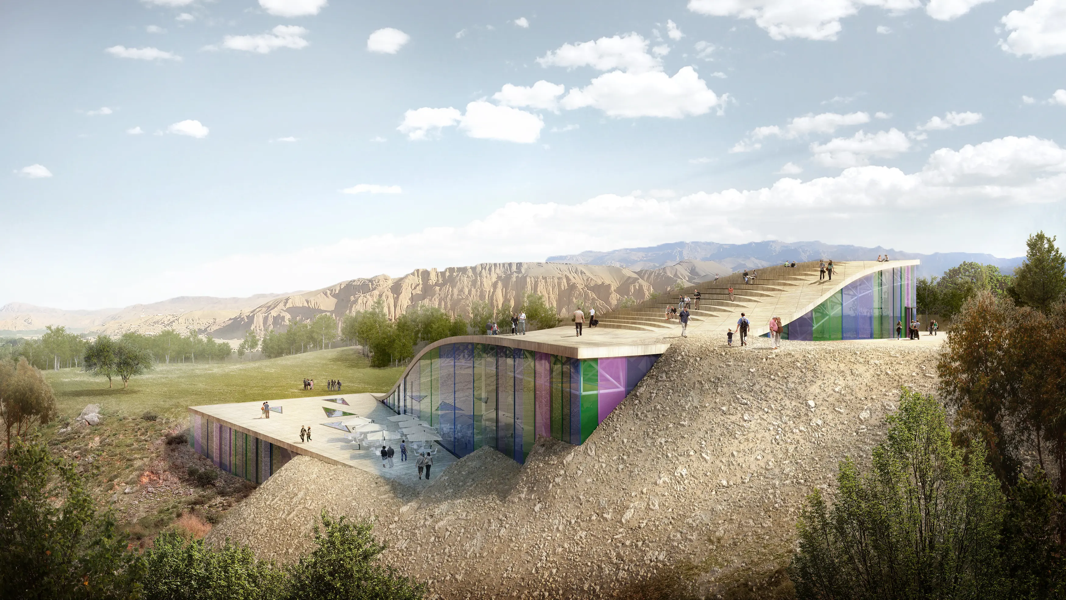 Prismatic cultural centre embedded in a rocky hillside.